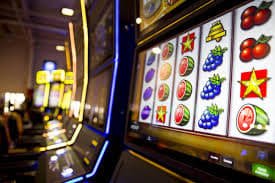 Slot game reels displayed on a tablet screen showing bonus round activation